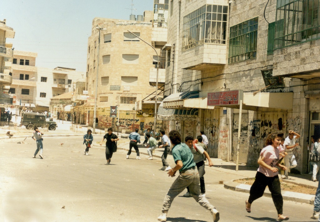 Youth throwing stones at Israeli army, ca. 1987. Source: Palestinian News Agency, WAFA. 